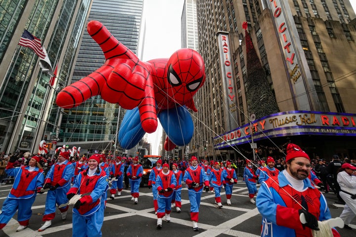 Macy’s Thanksgiving Day Parade Kicks Off In Manhattan - The Boston Courier 2 Balloon handlers guide the Spider Man balloon past Radio City Music Hall during the Macy's Thanksgiving Day Parade, Thursday, Nov. 27, 2025, in New York. (AP Photo/Eduardo Munoz Alvarez)